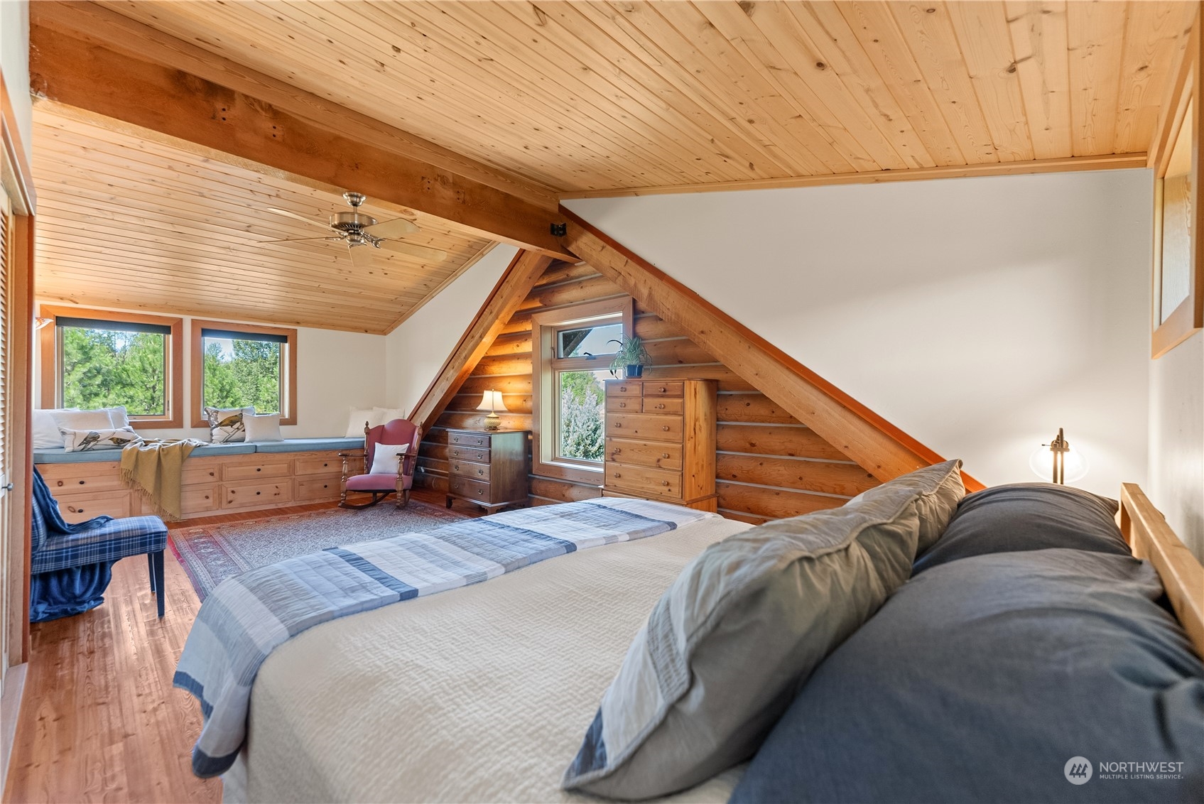 16 Lewisia Road Winthrop, WA 98862 - Photo 36 of 40 a bed room with a bed and a wooden floor