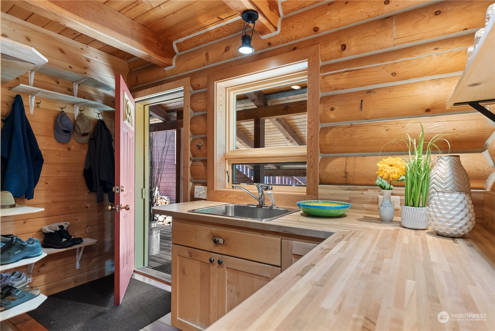 16 Lewisia Road Winthrop, WA 98862 - Photo 7 of 40 a kitchen with a sink and wooden cabinets
