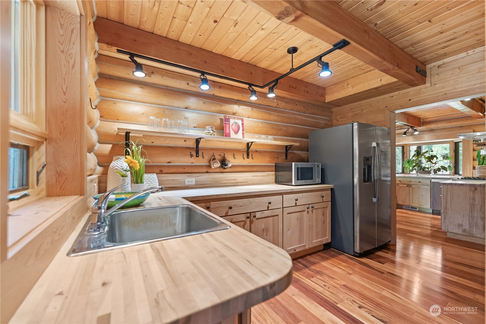 16 Lewisia Road Winthrop, WA 98862 - Photo 8 of 40 a kitchen with cabinets and wooden floor