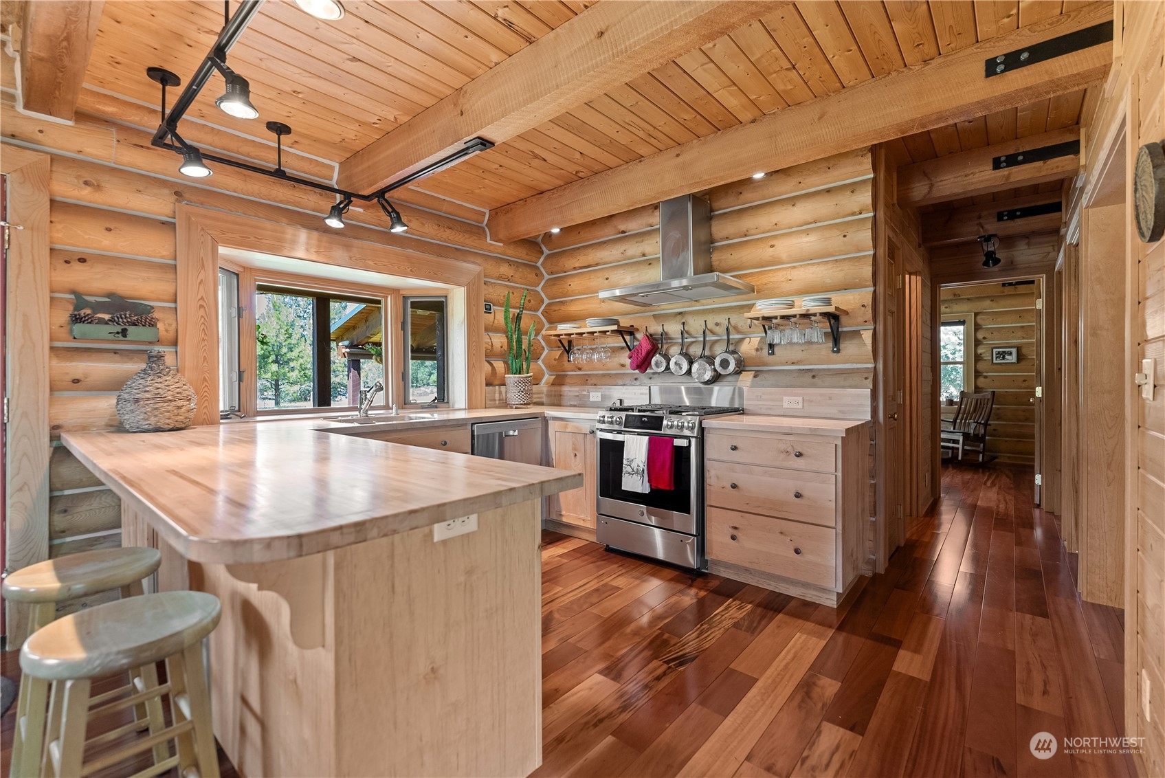 16 Lewisia Road Winthrop, WA 98862 - Photo 9 of 40 a view of a kitchen with cabinets and wooden floor