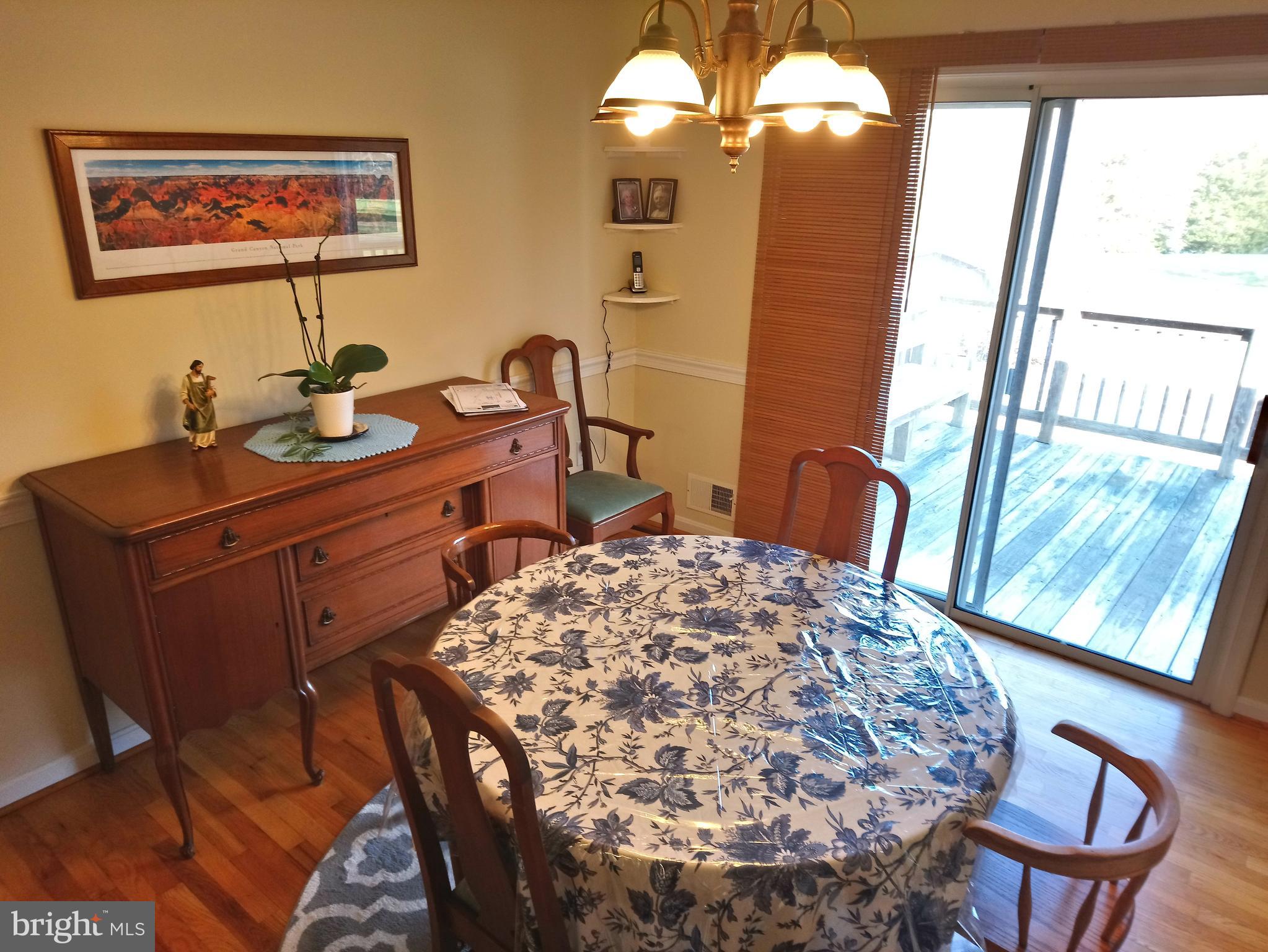 4520 Stratford Road Pomfret, MD 20675 - Photo 7 of 56 Dining room 12' x 10' 11" leading to rear deck