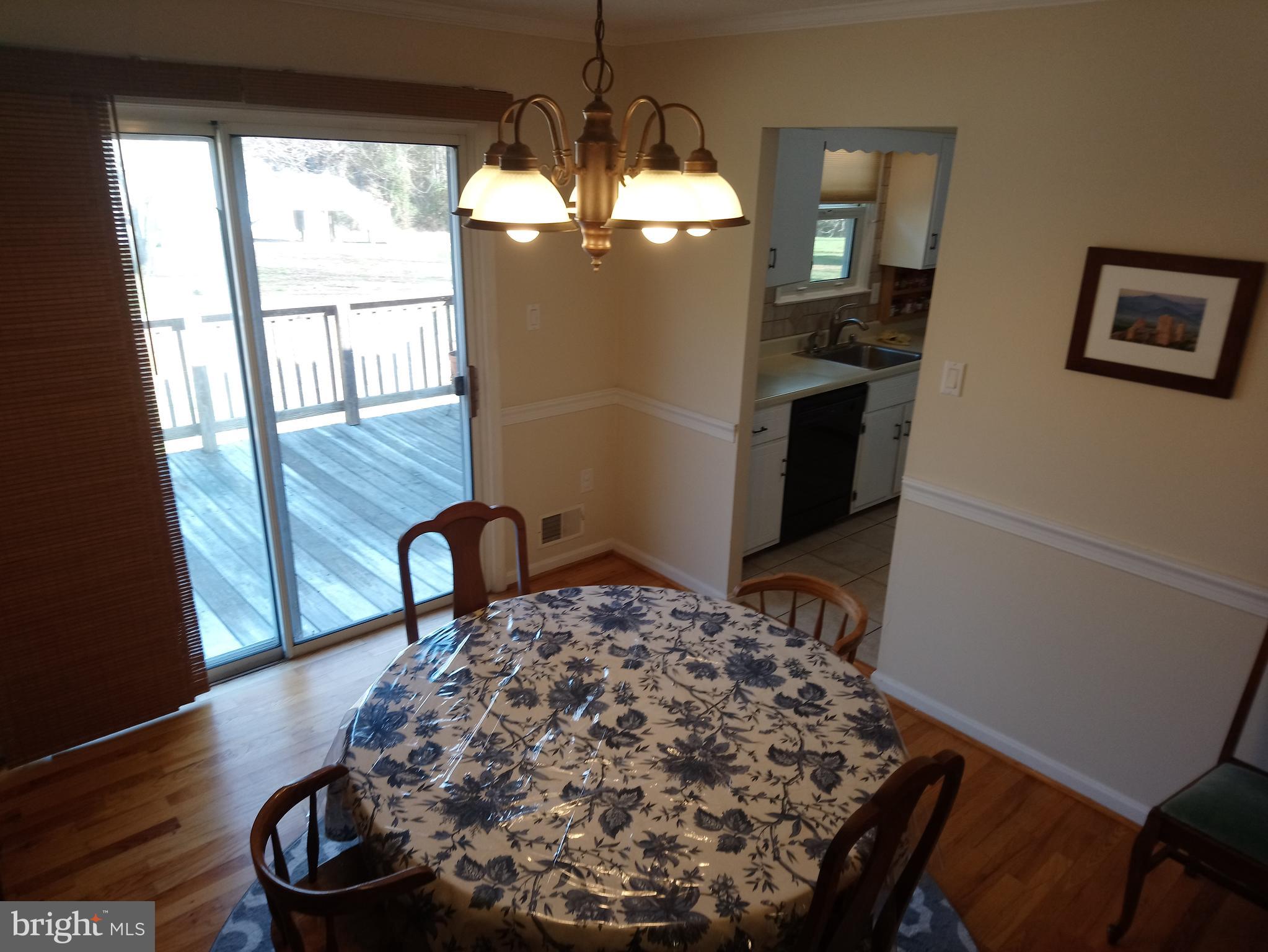 4520 Stratford Road Pomfret, MD 20675 - Photo 9 of 56 Dining room 12' x 10' 11" leading to rear deck
