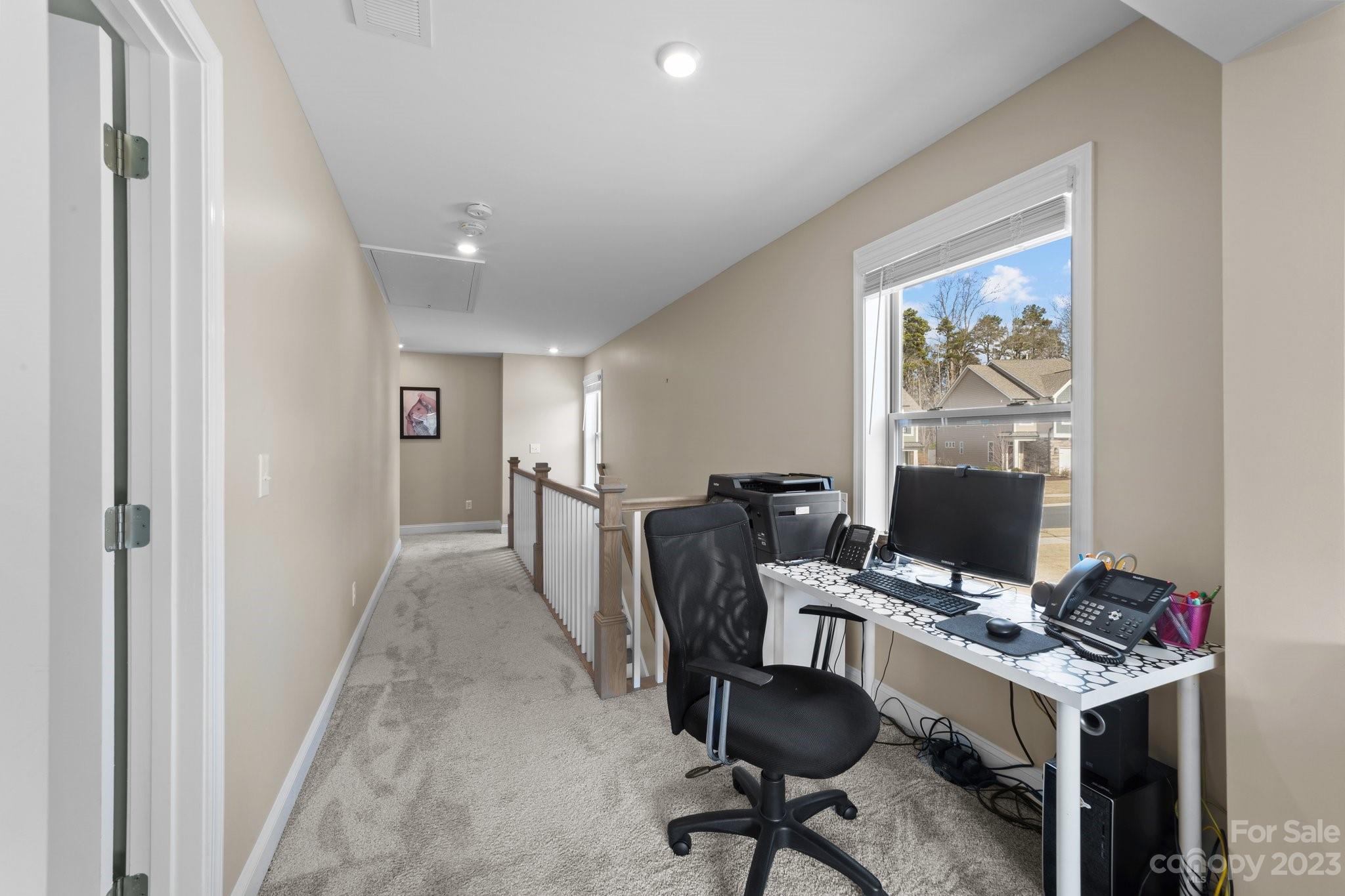 2041 Suttonview Road Fort Mill, SC 29708 - Photo 13 of 27 a view of a workspace with furniture and a window