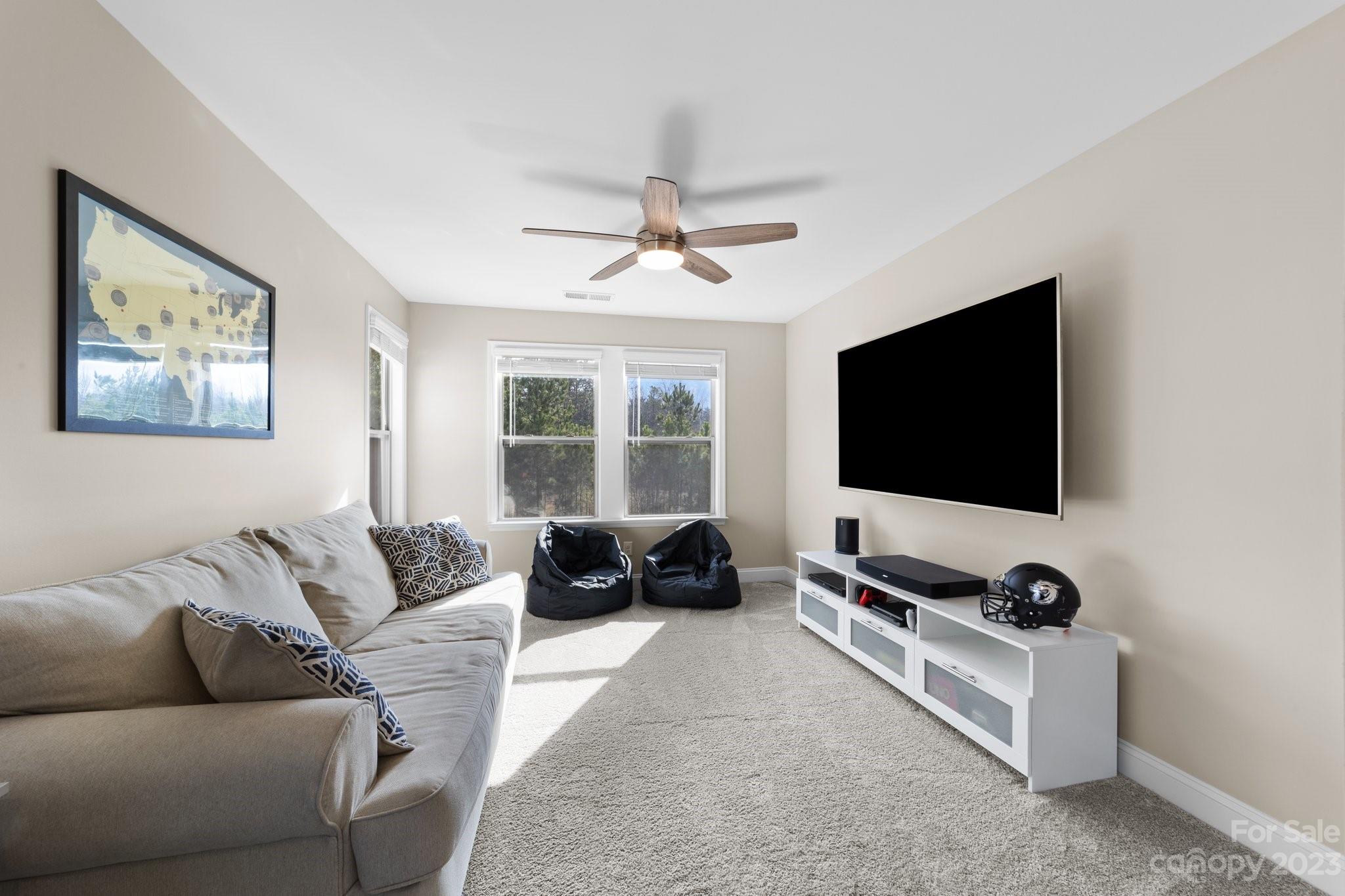 2041 Suttonview Road Fort Mill, SC 29708 - Photo 14 of 27 a living room with furniture and a flat screen tv