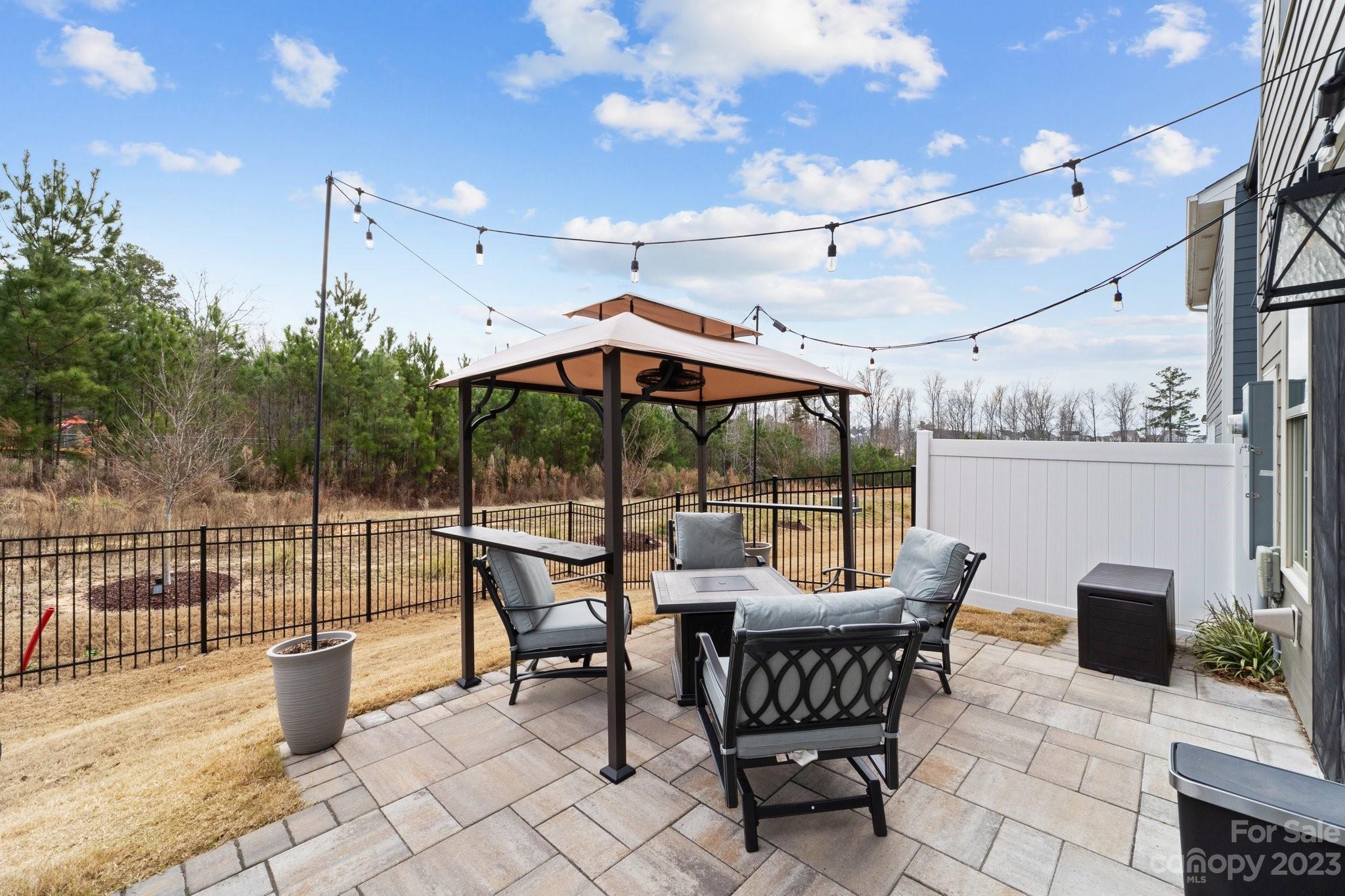 2041 Suttonview Road Fort Mill, SC 29708 - Photo 24 of 27 a view of a patio with a dining table and chairs