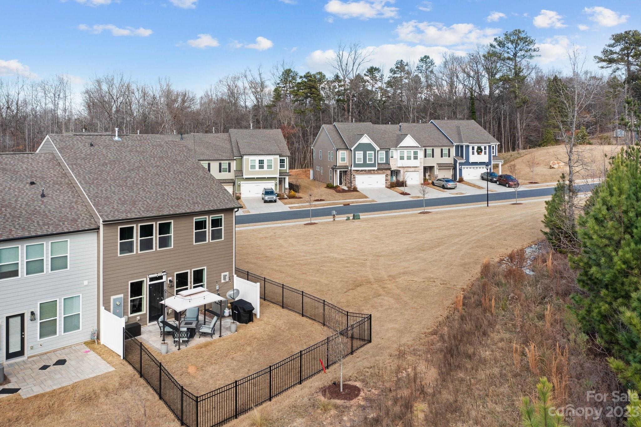 2041 Suttonview Road Fort Mill, SC 29708 - Photo 3 of 27 a view of roof deck with couches and wooden fence