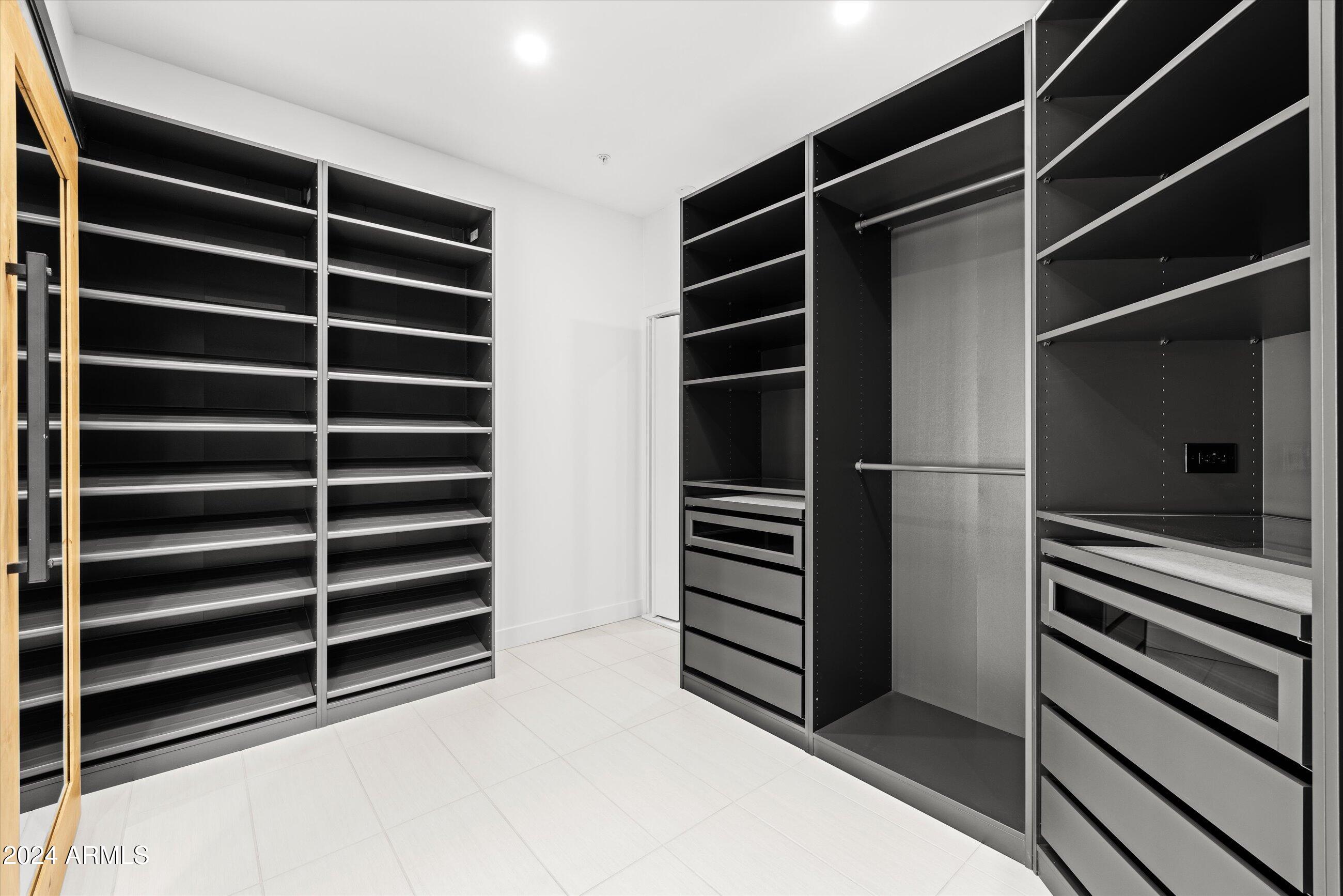 7705 East Doubletree Ranch Road, Unit 46 Scottsdale, AZ 85258 - Photo 22 of 52 CUSTOM CABINETS IN MASTER WALK IN