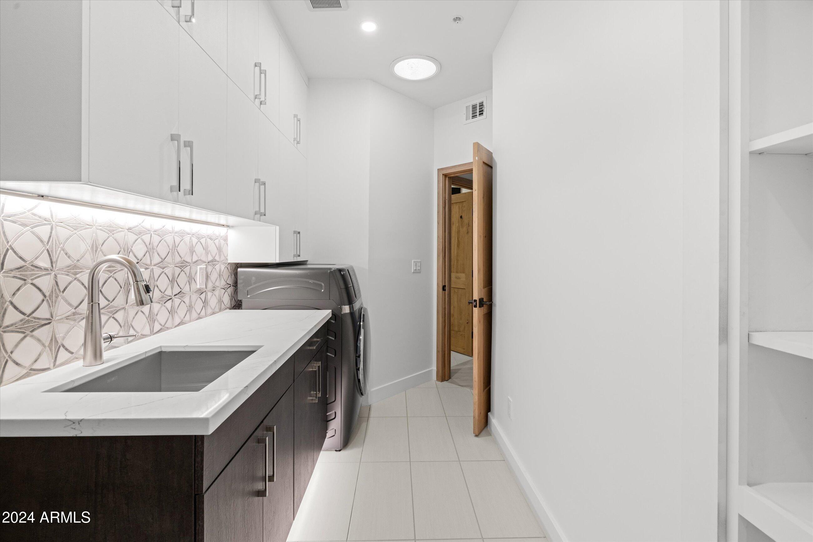7705 East Doubletree Ranch Road, Unit 46 Scottsdale, AZ 85258 - Photo 31 of 52 LAUNDRY ROOM