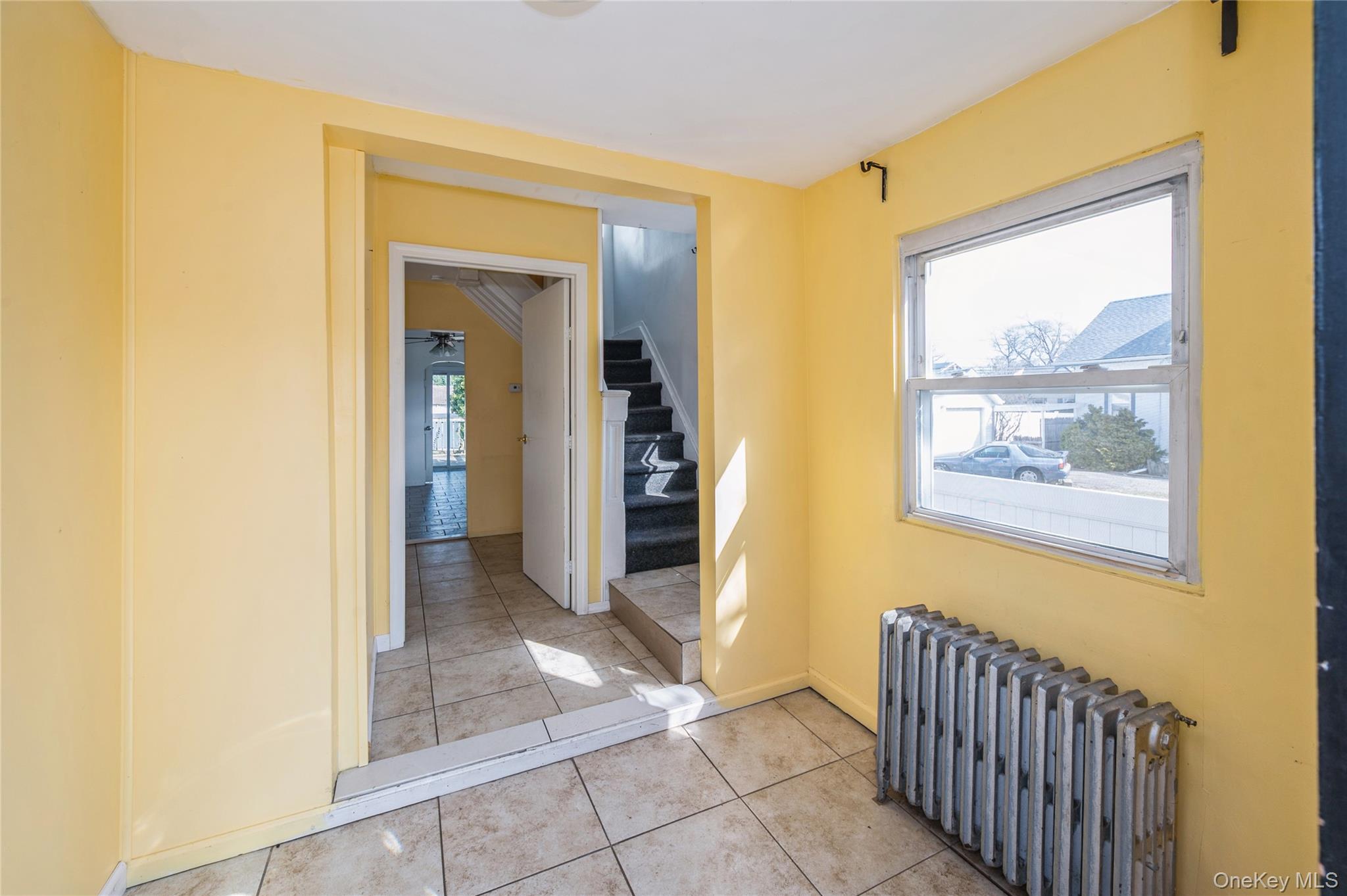 5 Church Street Baldwin, NY 11510 - Photo 12 of 32 a view of a hallway view with wooden floor and a bathroom