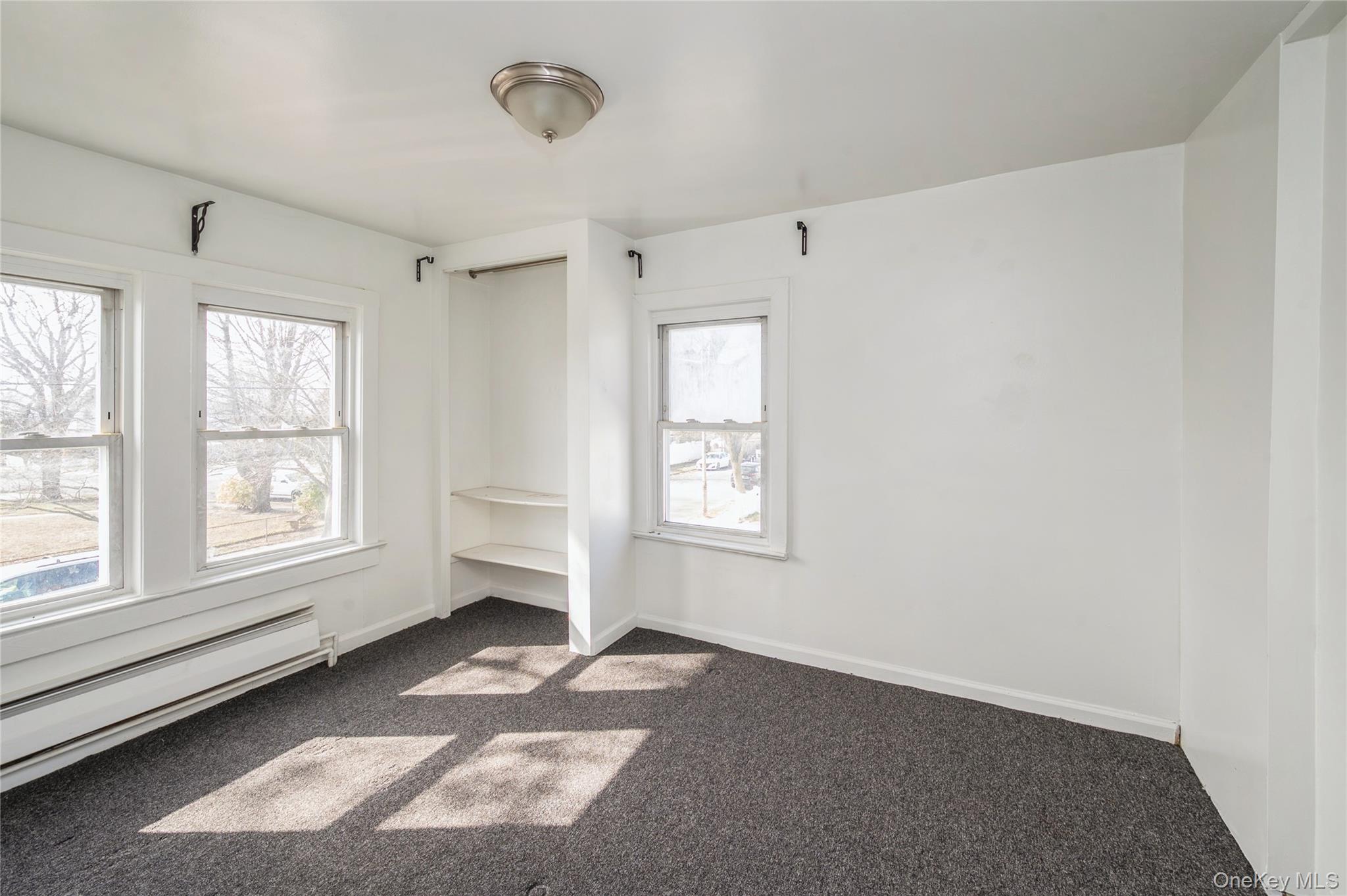 5 Church Street Baldwin, NY 11510 - Photo 20 of 32 an empty room with windows