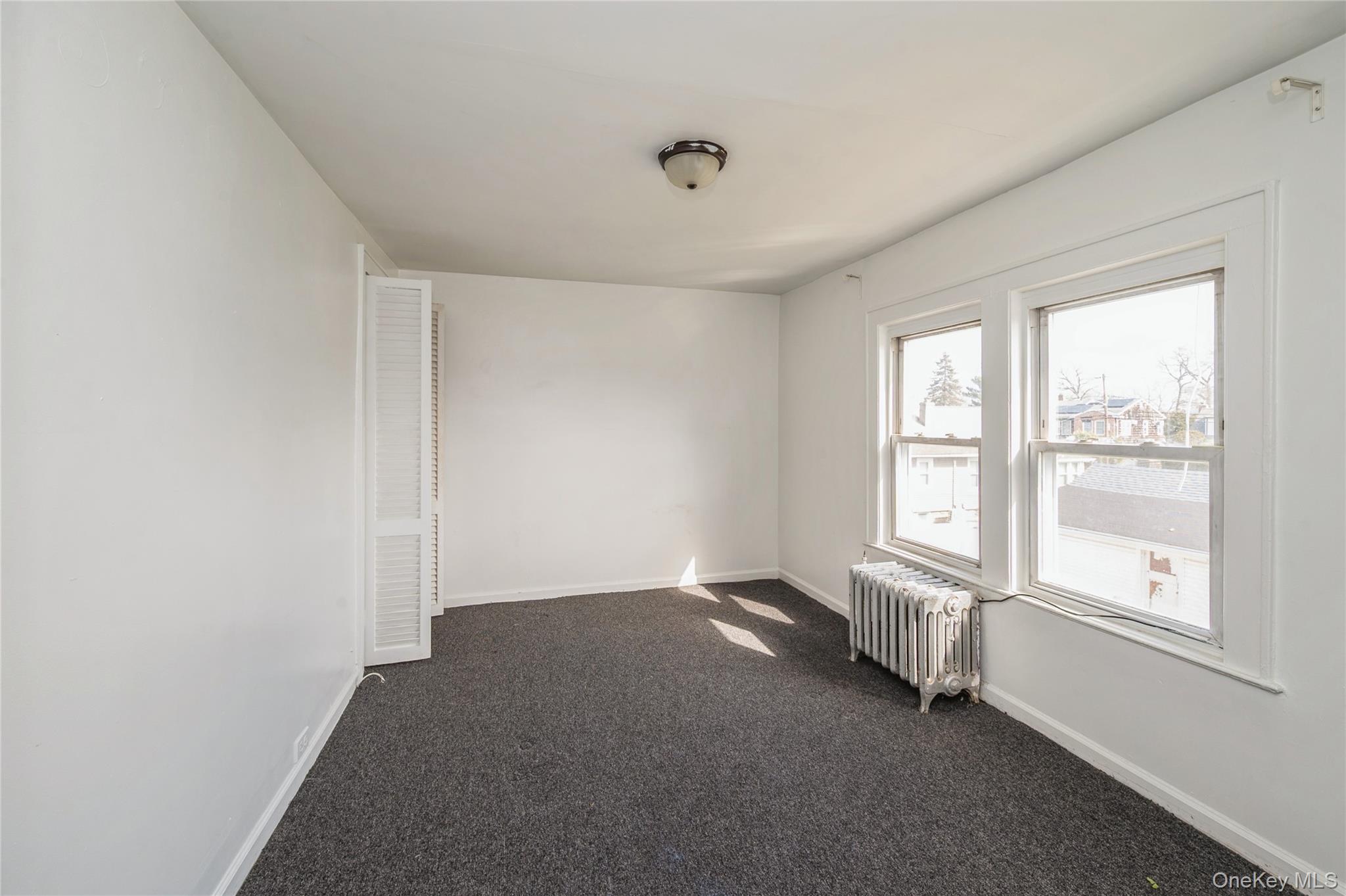 5 Church Street Baldwin, NY 11510 - Photo 21 of 32 an empty room with a window