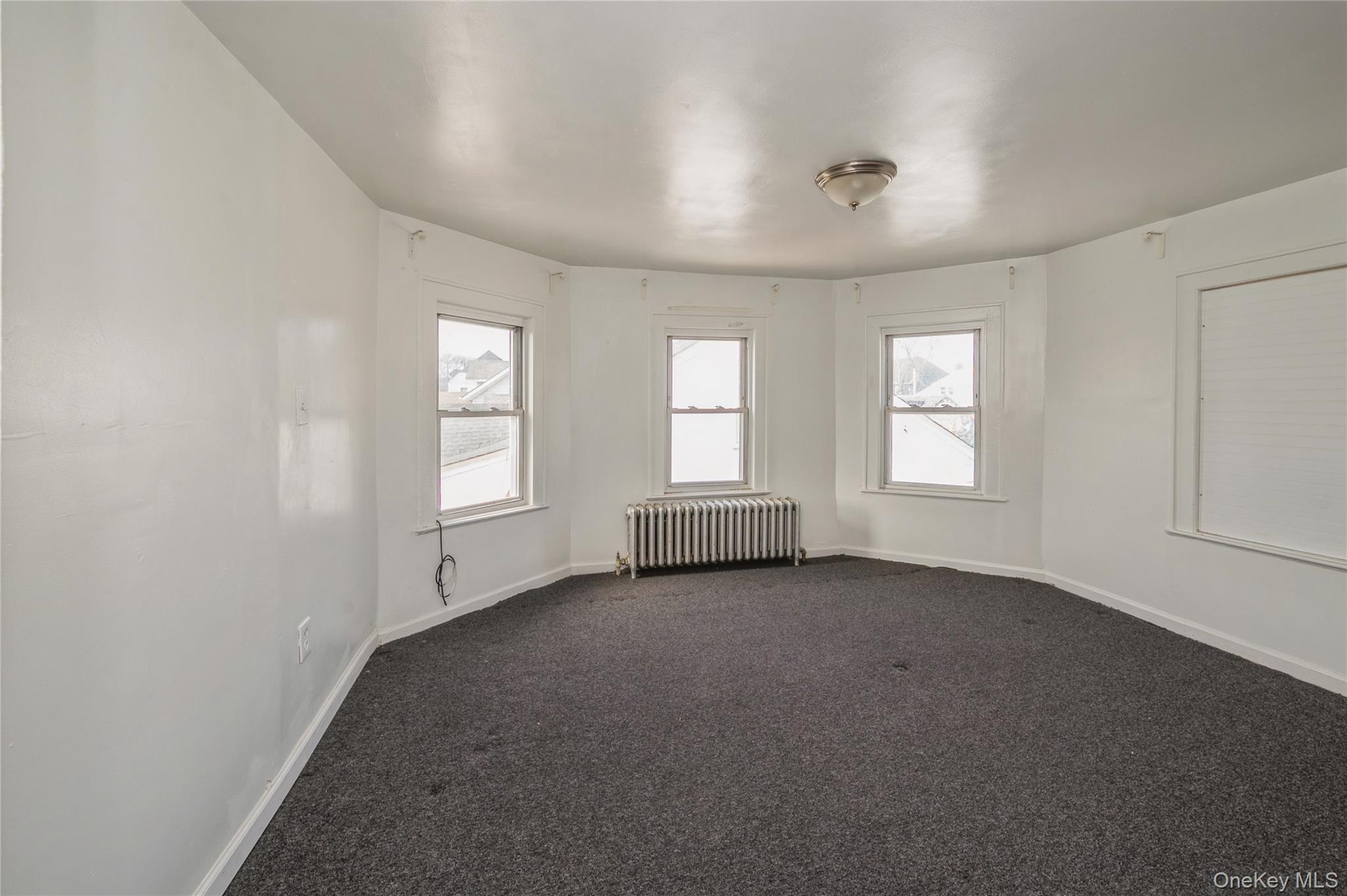 5 Church Street Baldwin, NY 11510 - Photo 22 of 32 an empty room with windows
