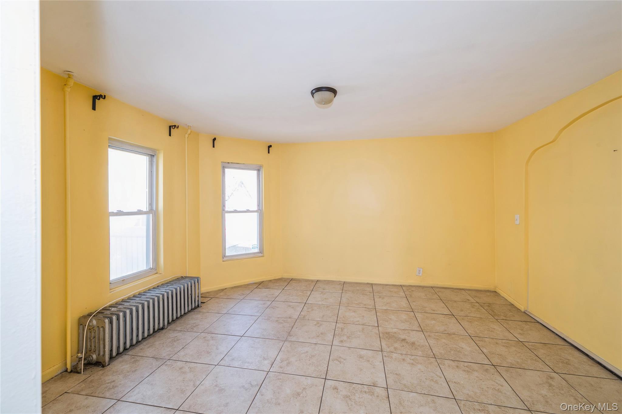 5 Church Street Baldwin, NY 11510 - Photo 10 of 32 a view of an empty room with a window