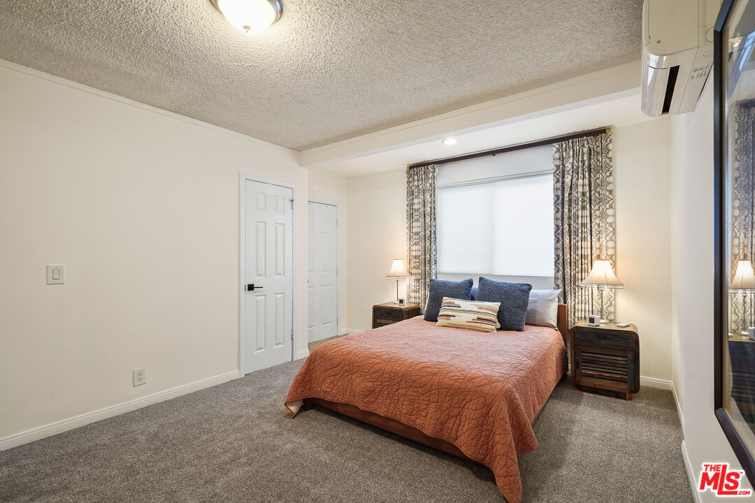511 Crosby Street Altadena, CA 91001 - Photo 16 of 38 a bedroom with a bed and a window