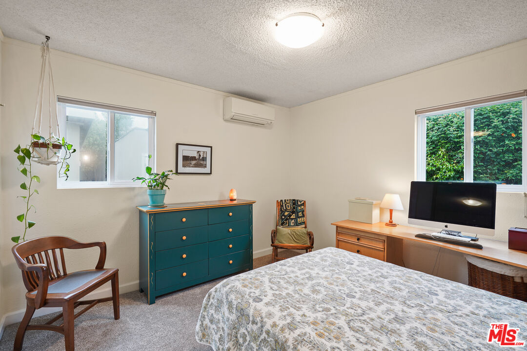 511 Crosby Street Altadena, CA 91001 - Photo 21 of 38 a bedroom with a bed and a flat screen tv