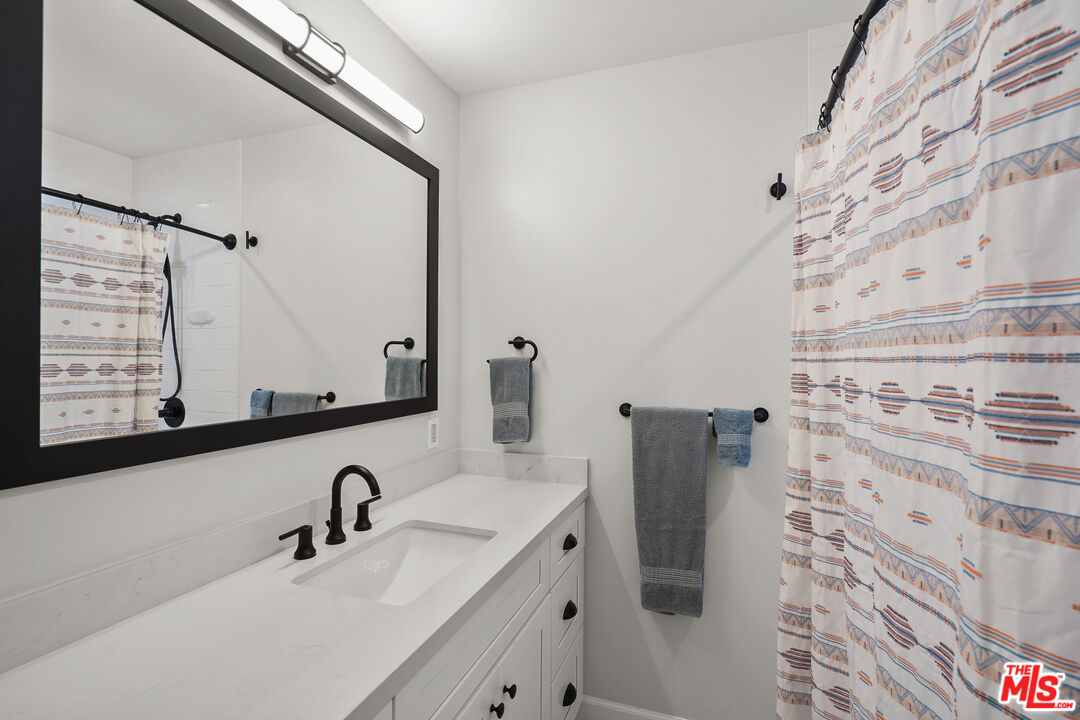 511 Crosby Street Altadena, CA 91001 - Photo 25 of 38 a bathroom with a sink and mirror