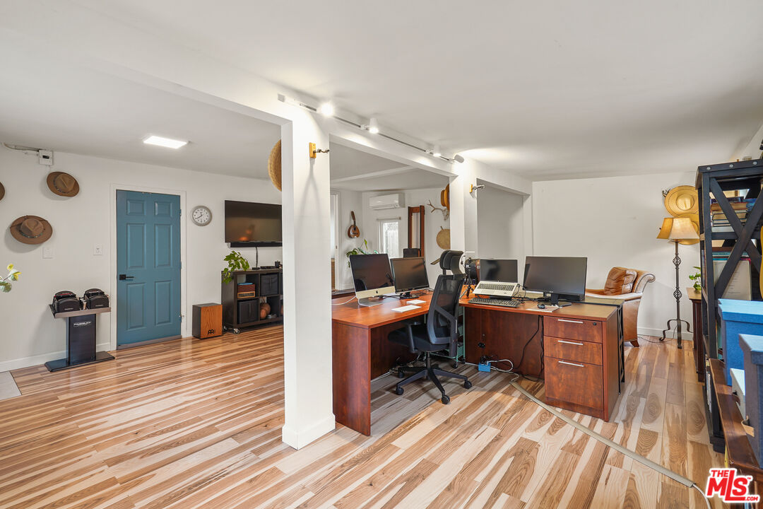 511 Crosby Street Altadena, CA 91001 - Photo 27 of 38 a living room with furniture a flat screen tv and a wooden floor