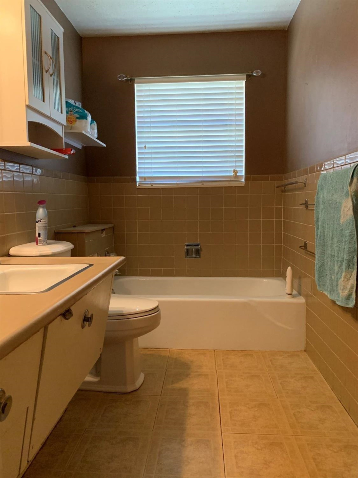 1208 Ave M Ralls, TX 79357 - Photo 11 of 22 a bathroom with a sink a toilet and bathtub