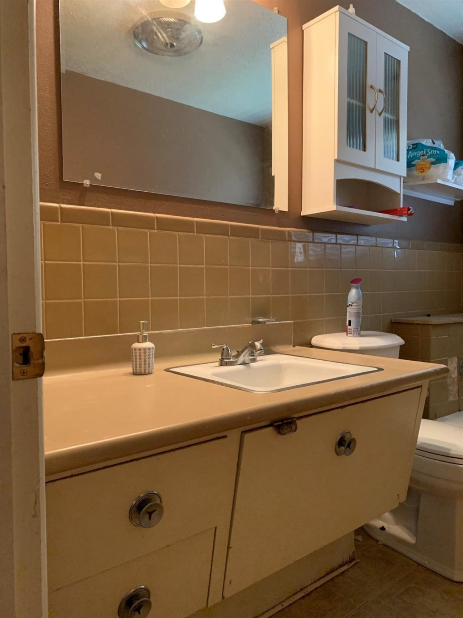 1208 Ave M Ralls, TX 79357 - Photo 12 of 22 a bathroom with a sink and a washing machine