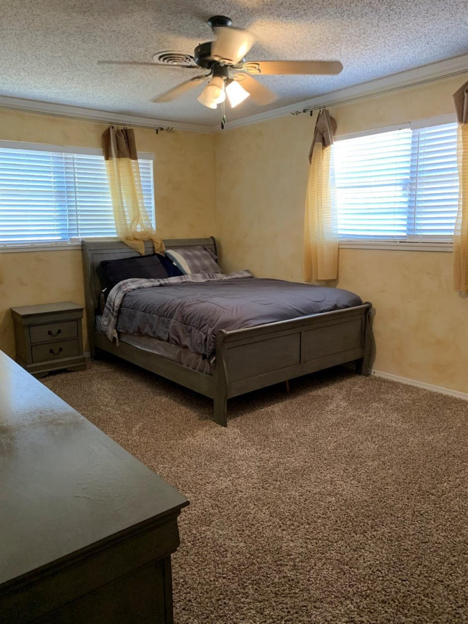 1208 Ave M Ralls, TX 79357 - Photo 6 of 22 a bedroom with a bed dresser and a window