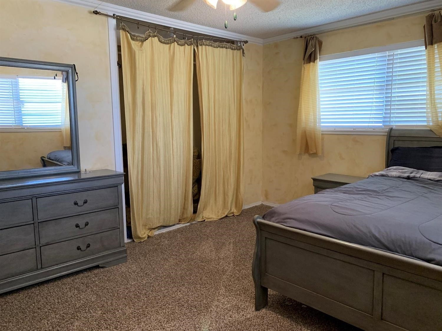1208 Ave M Ralls, TX 79357 - Photo 7 of 22 a bedroom with a bed and a dresser in it