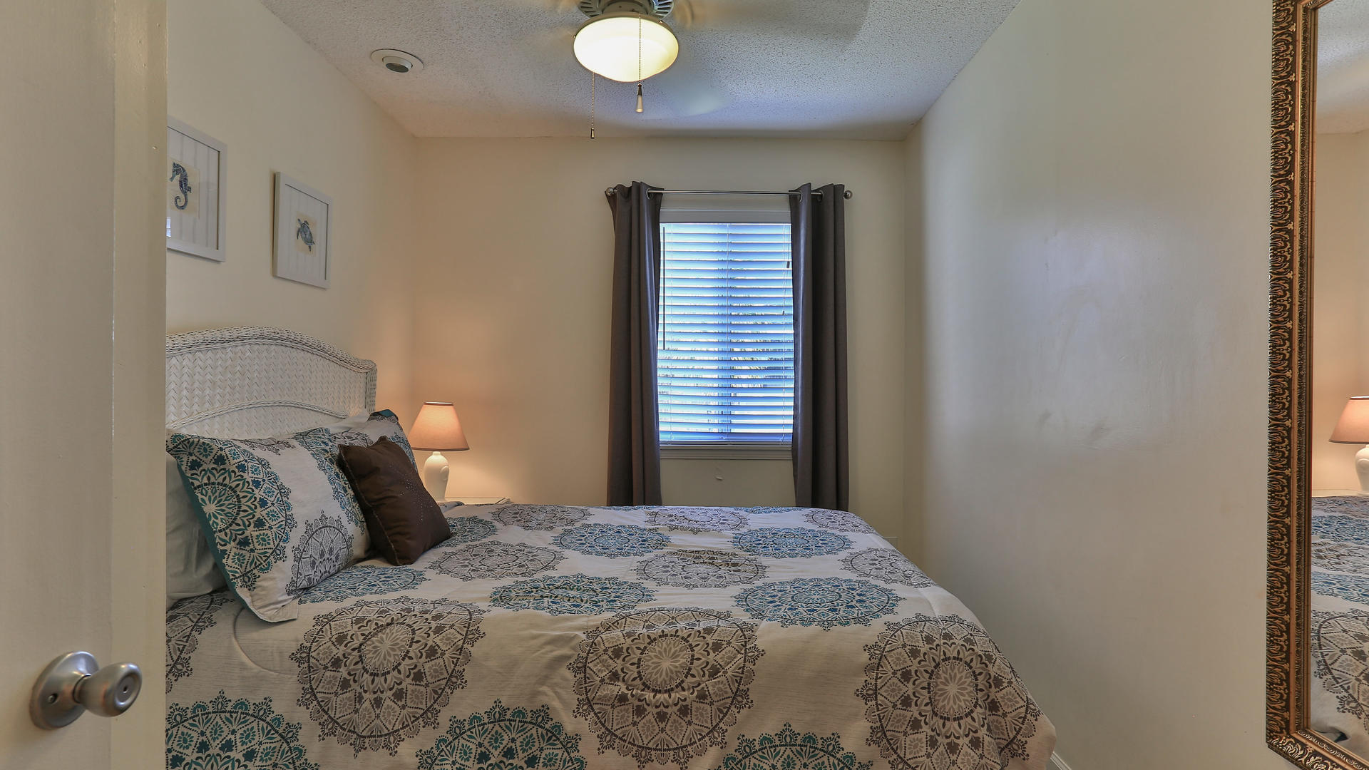 940 Highway 98, Unit 102 Destin, FL 32541 - Photo 14 of 18 a bedroom with a bed and a window