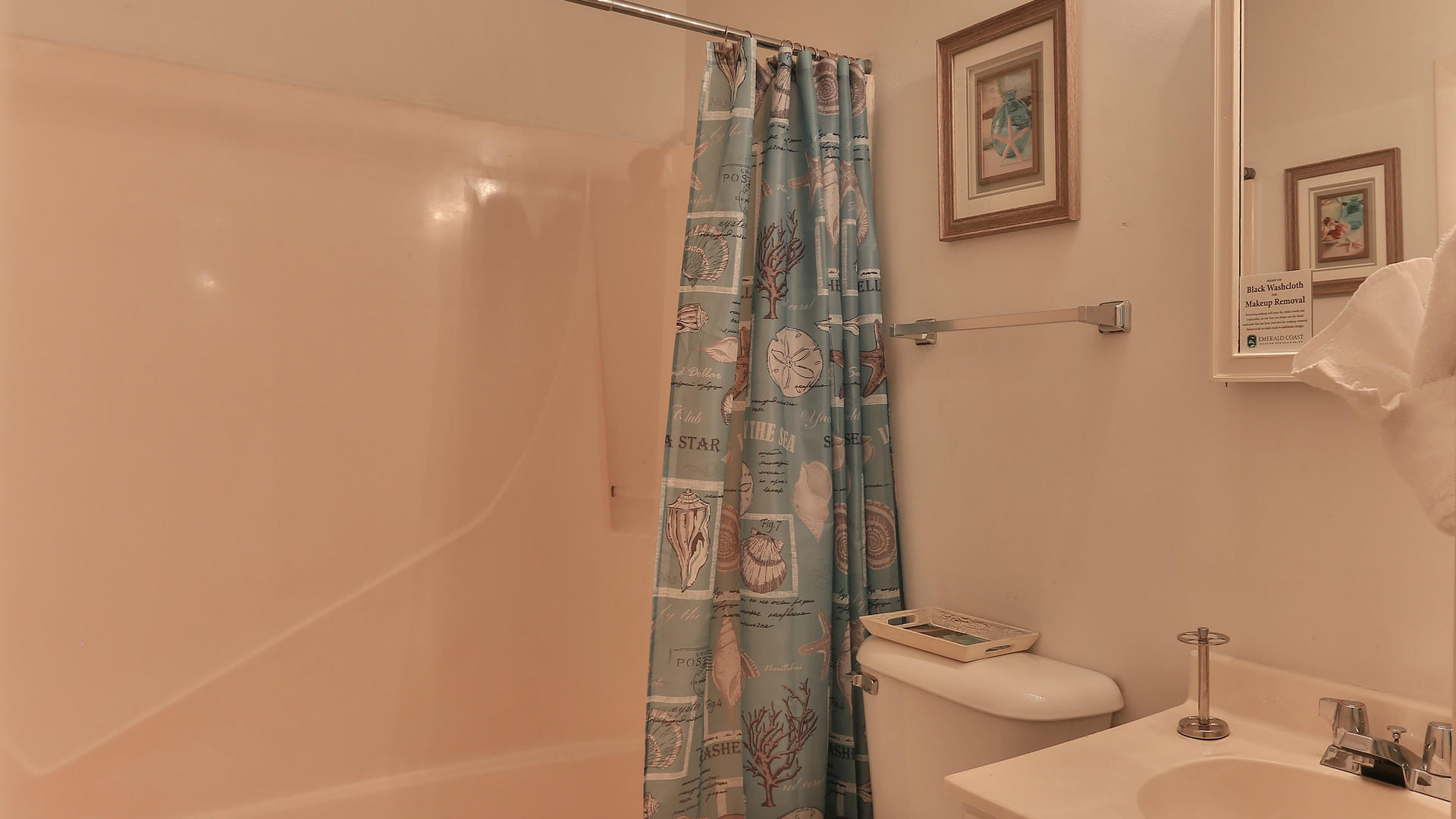 940 Highway 98, Unit 102 Destin, FL 32541 - Photo 16 of 18 a bathroom with a shower and toilet