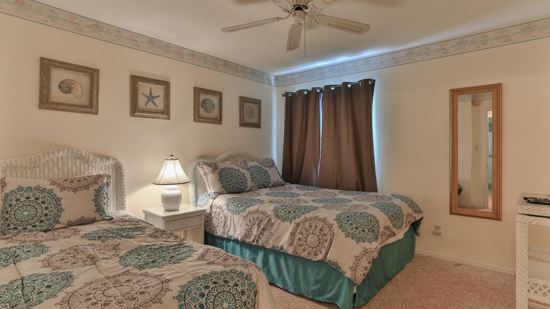 940 Highway 98, Unit 102 Destin, FL 32541 - Photo 17 of 18 a bedroom with a bed and ceiling fan