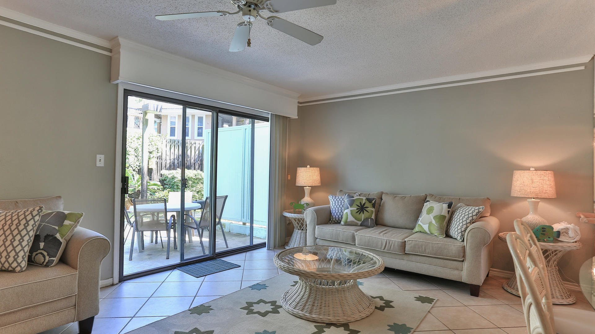 940 Highway 98, Unit 102 Destin, FL 32541 - Photo 10 of 18 a living room with furniture and a large window with balcony view