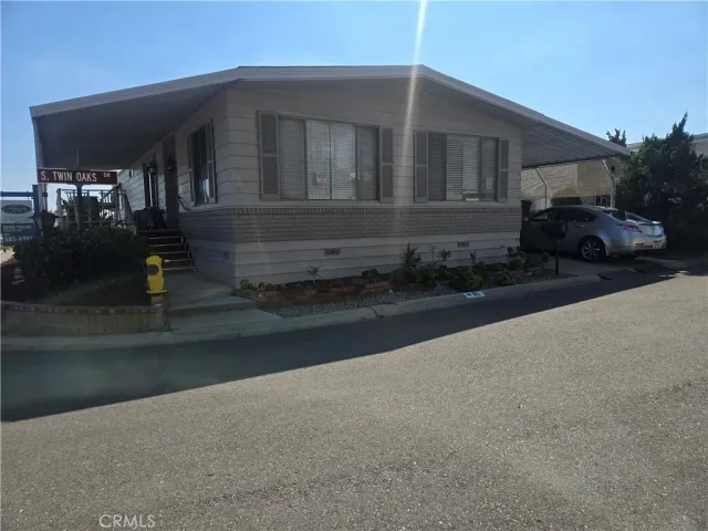 a view of a car park front of house