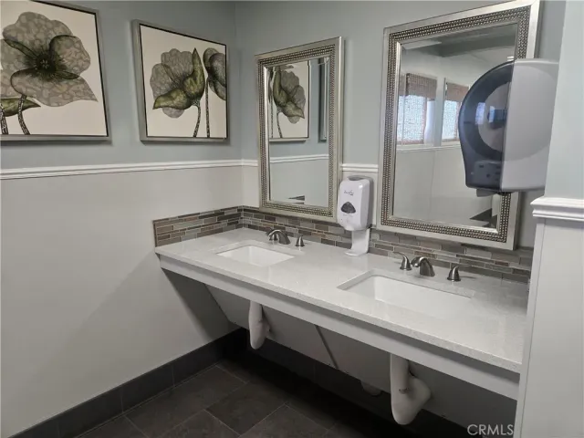 a living room with furniture and a chair