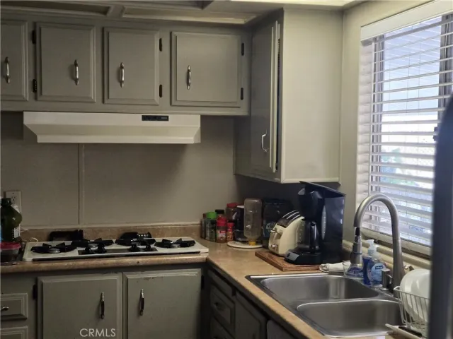 a white refrigerator freezer sitting inside of a kitchen