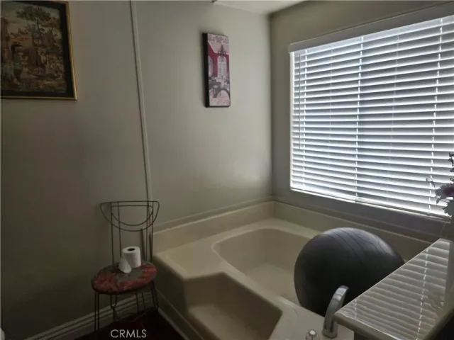 a room with sink and mirror