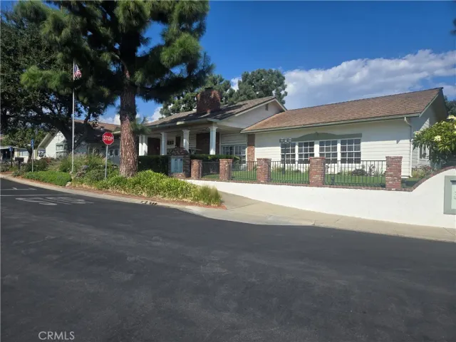 a large kitchen with a table and chairs