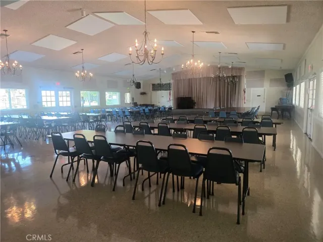 a view of a chairs and table in the patio