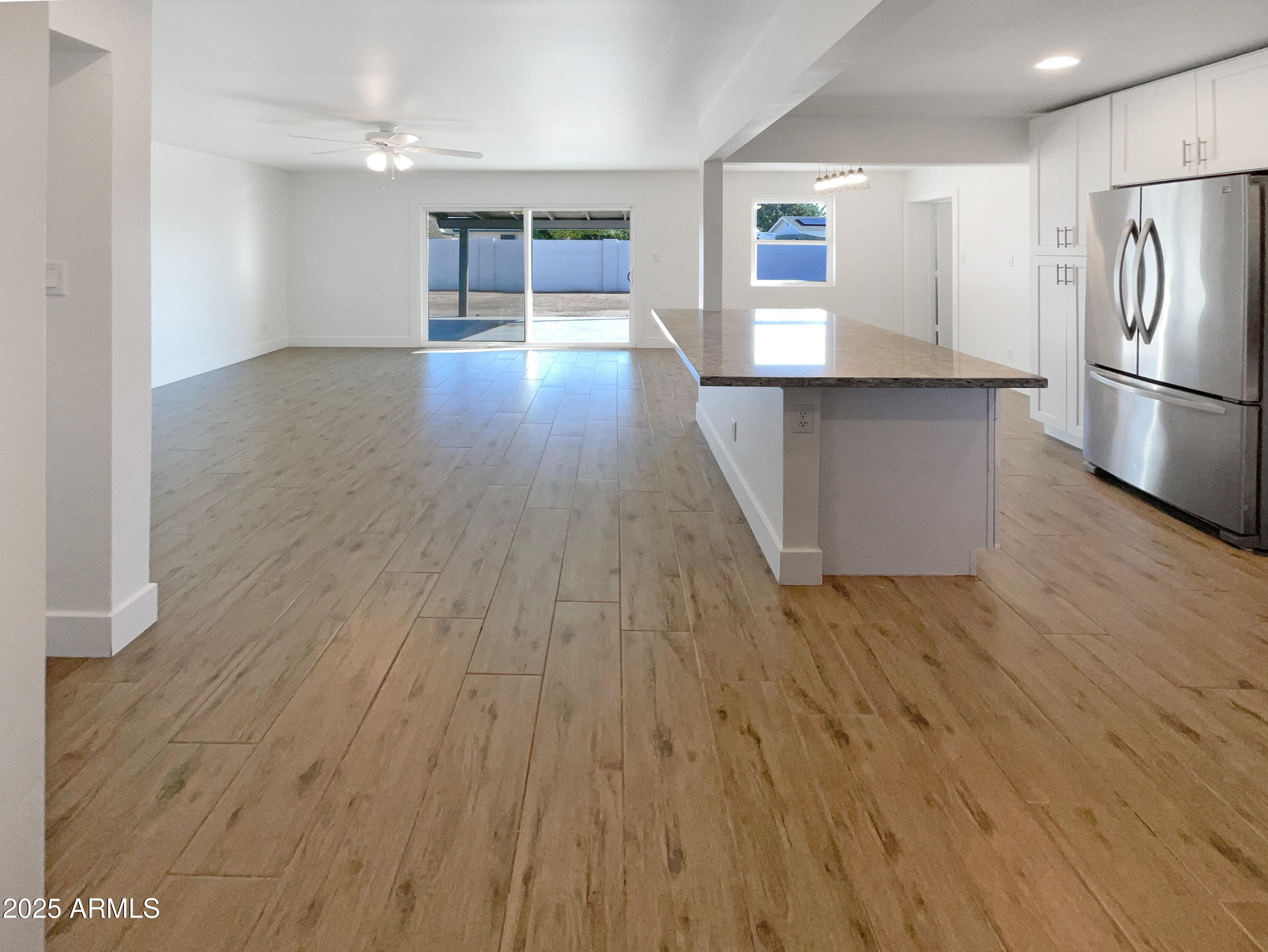 7231 North 23rd Avenue Phoenix, AZ 85021 - Photo 7 of 28 a view of a kitchen with a sink and a refrigerator