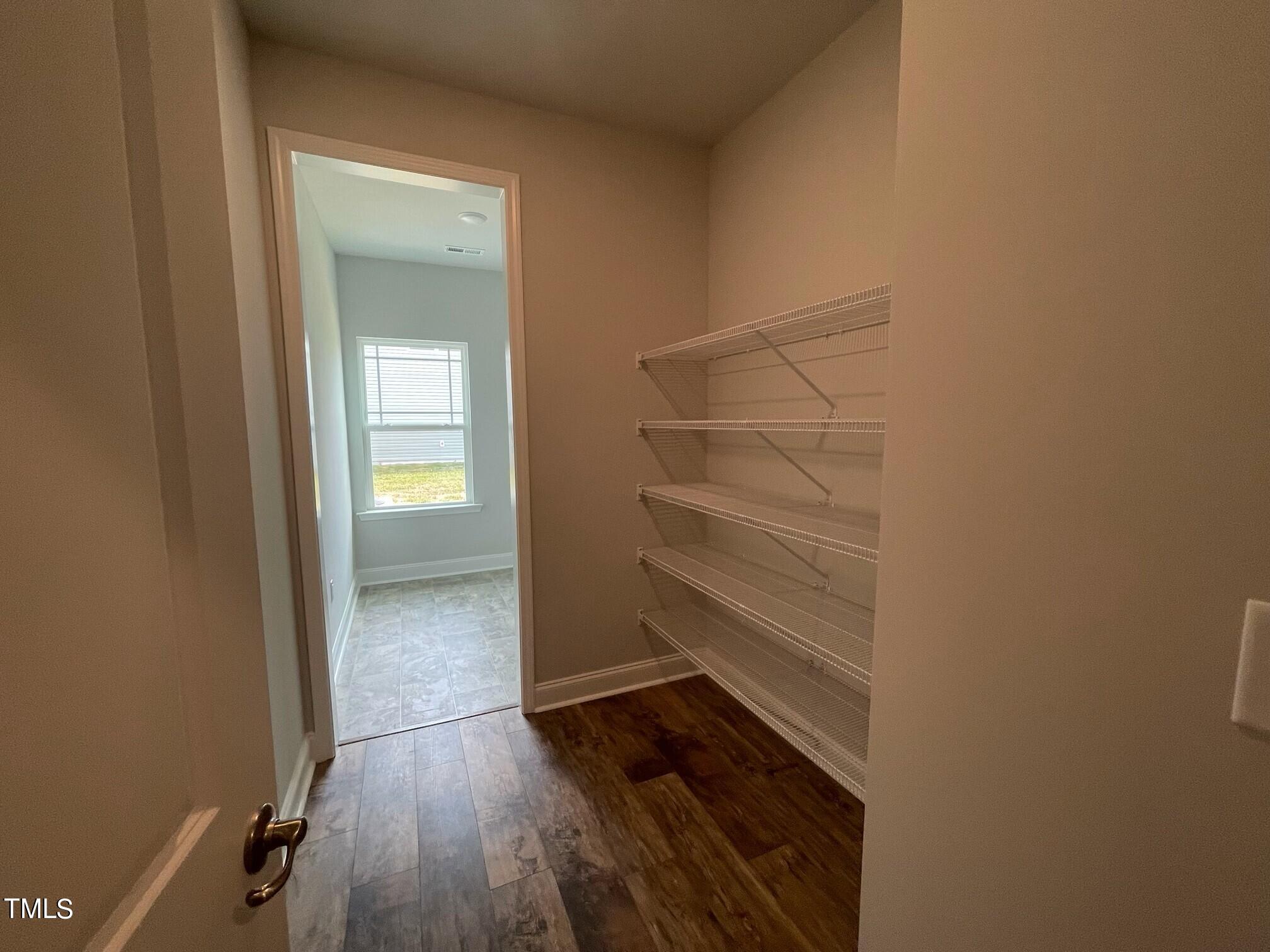 4356 Coolwater Drive Bailey, NC 27807 - Photo 7 of 17 a view of walk in closet with empty racks
