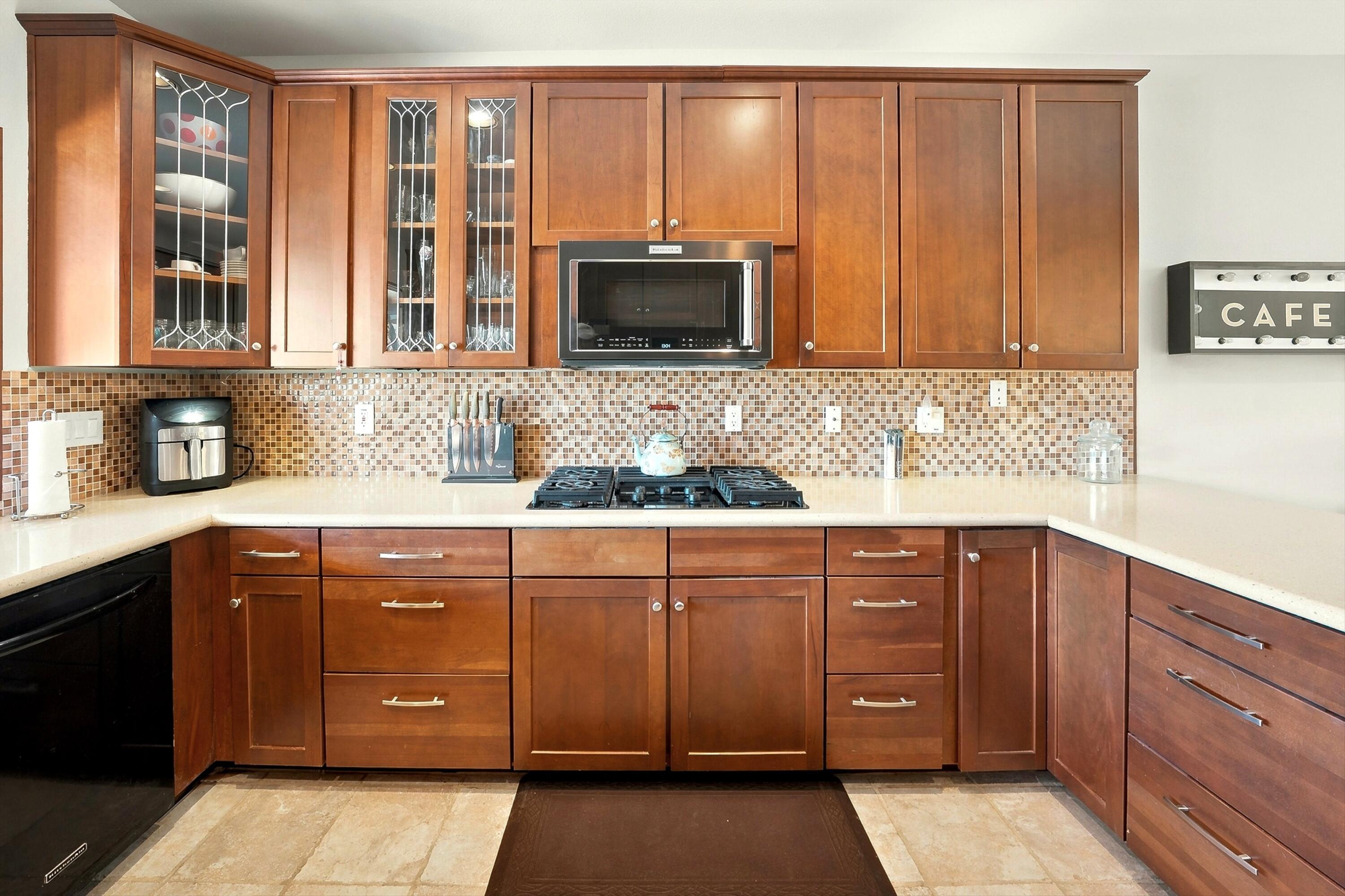 138 Lakeshore Drive Rancho Mirage, CA 92270 - Photo 9 of 30 a kitchen with a sink and wooden cabinets