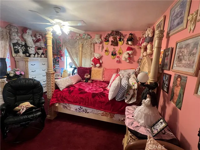 a bedroom with bed and a window