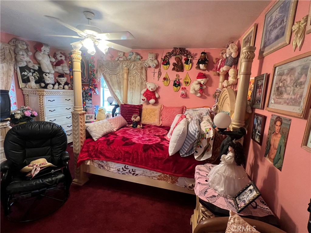 8310 South Broadway Los Angeles, CA 90003 - Photo 12 of 28 a bedroom with bed and a window