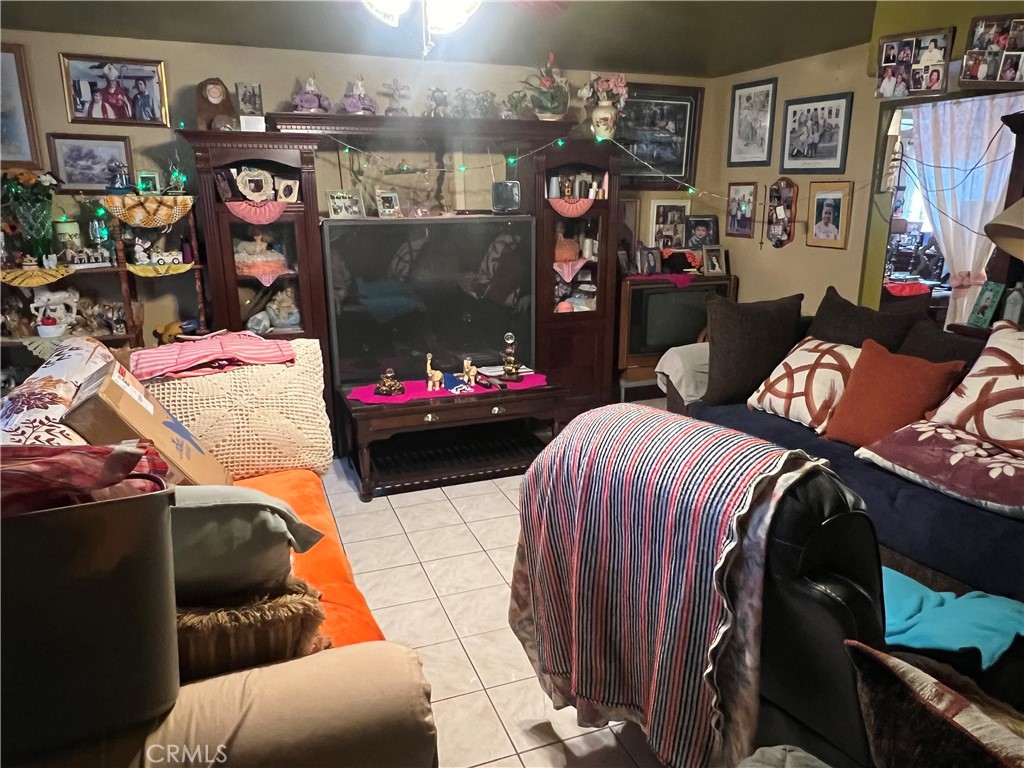 8310 South Broadway Los Angeles, CA 90003 - Photo 15 of 28 a bedroom with furniture and a bed