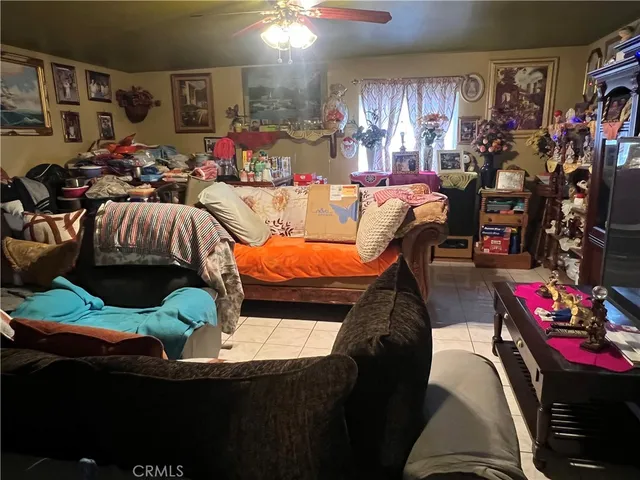 a bed room with furniture and a flat screen tv