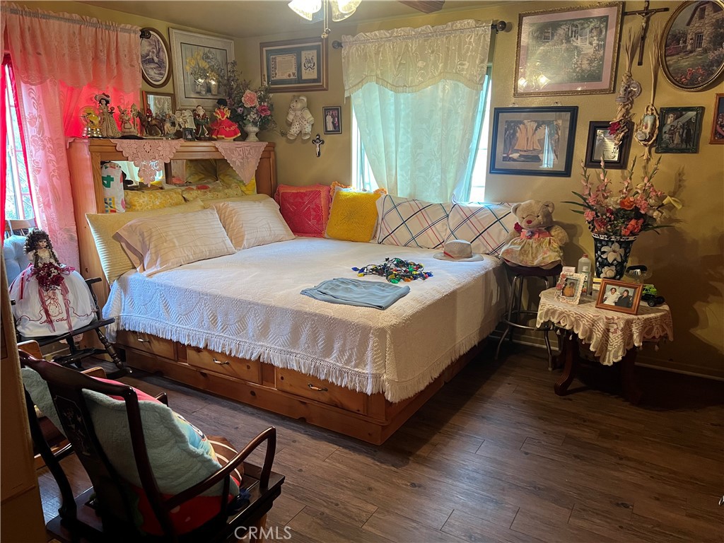 8310 South Broadway Los Angeles, CA 90003 - Photo 21 of 28 a bed room with a bed and a couch