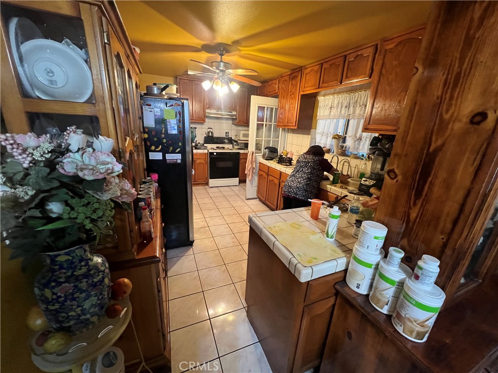 8310 South Broadway Los Angeles, CA 90003 - Photo 24 of 28 a view of a dining room with furniture window and wooden floor
