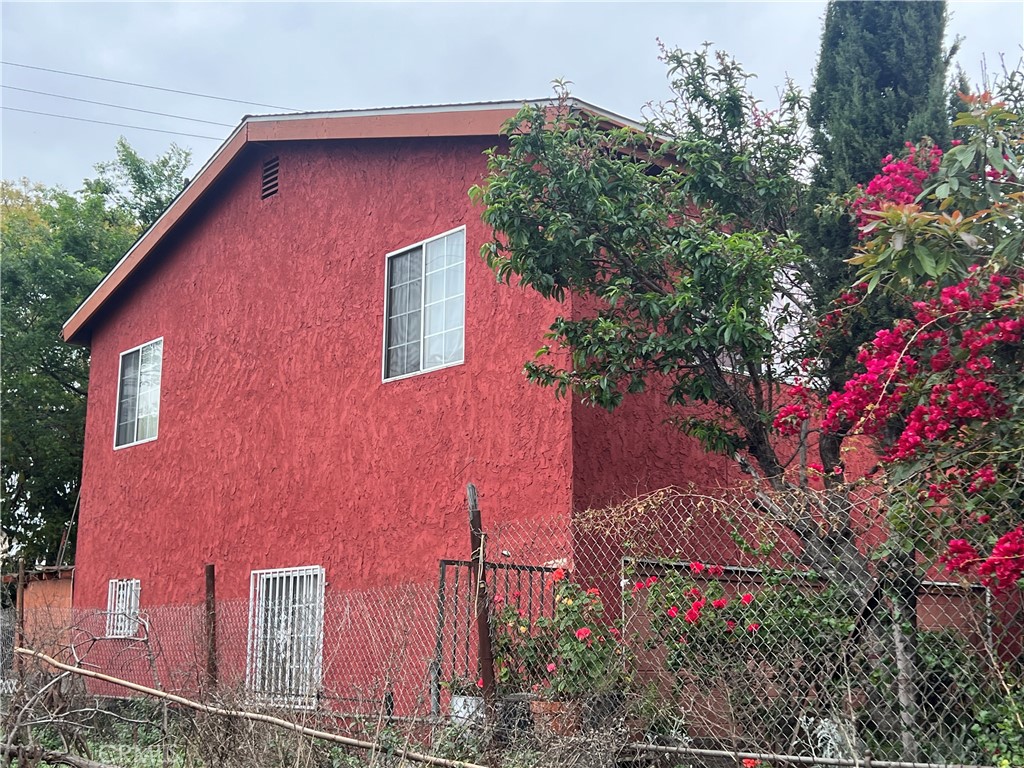 8310 South Broadway Los Angeles, CA 90003 - Photo 5 of 28 a front view of a house with a yard