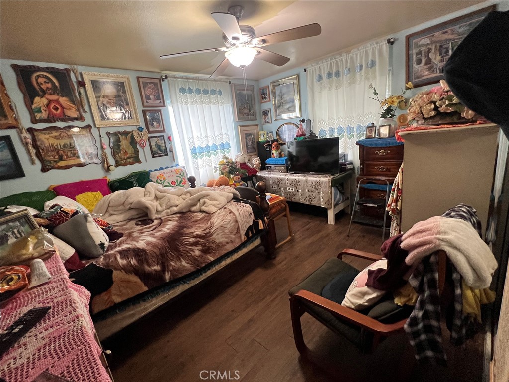 8310 South Broadway Los Angeles, CA 90003 - Photo 10 of 28 a bedroom with furniture and a couch