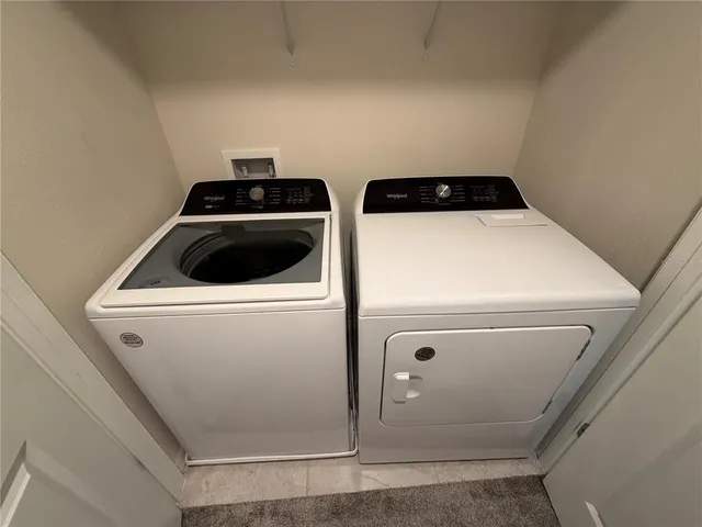 a utility room with dryer and washer