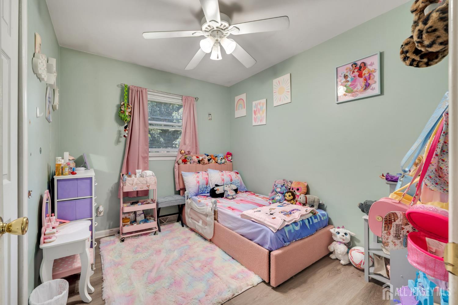 12 Pierrepont Avenue Middlesex, NJ 08846 - Photo 15 of 30 a bedroom with a bed and a chandelier