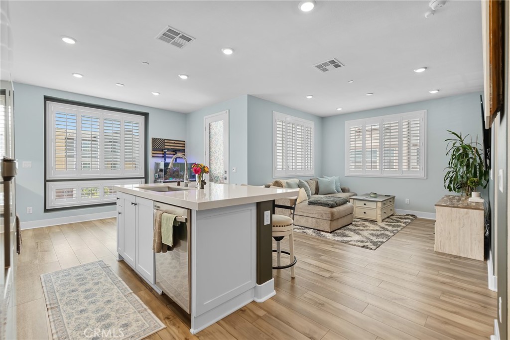 705 Arrowleaf Road Rancho Mission Viejo, CA 92694 - Photo 11 of 48 a open kitchen with stainless steel appliances granite countertop a stove and a large refrigerator