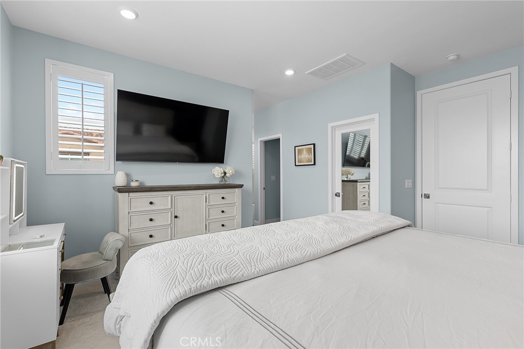 705 Arrowleaf Road Rancho Mission Viejo, CA 92694 - Photo 16 of 48 a bedroom with a bed and a flat screen tv